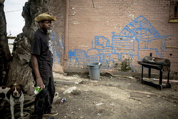 A South City resident hangs out outside of the Friendly Food Mart on the corner of Danny Thomas and Mississippi Avenue. It closed earlier in the summer after business slowed down following the shutting down and demolition of Foote Homes.