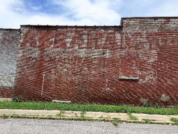 For many, a family business provides a legacy. This ghost sign has remained longer than the business' active life. 