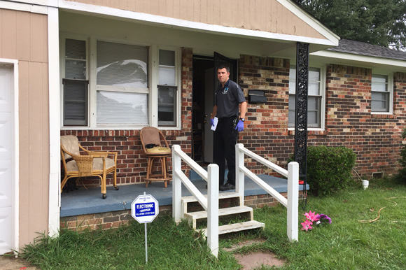 Dr. Steven Euler knocks on the front door for a nonemergency call reporting nausea and dizziness.