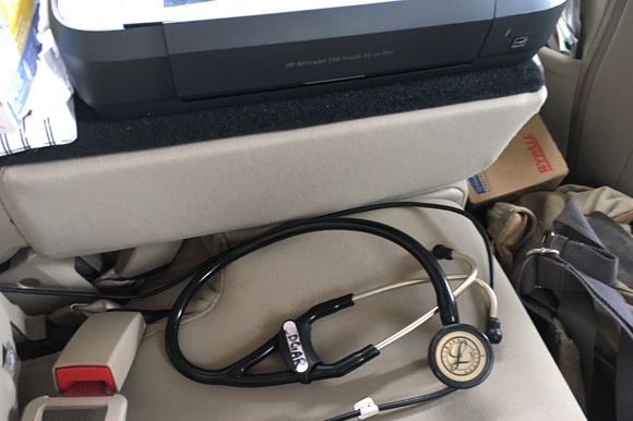 Basic equipment stored in the back seat of a RADAR car includes a stethoscope and a wireless printer.