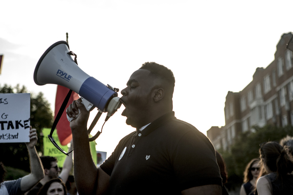 Antonio Cathey leads chants while paused in front of the McDonald’s on Union Avenue.