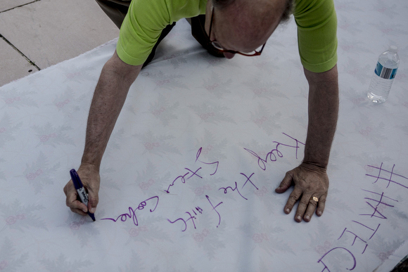 Rep. Steve Cohen signs a solidarity banner that was rolled out. 'Keep the Faith,' he wrote.