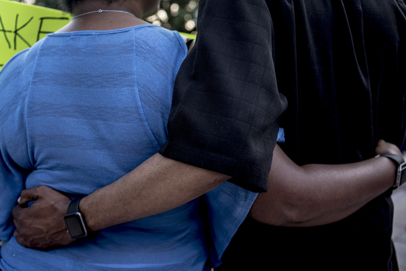Community members embrace each other during a call to meet and greet a new person in the crowd during the Memphis event held in solidarity with Charlottesville.