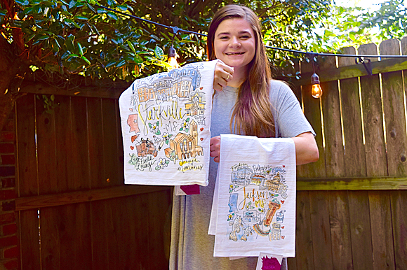 Bauman has added dishtowels that feature her lively illustrations and colorful point-of-view to her product line.
