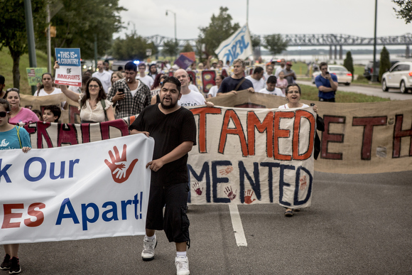 Over 100 people gathered at Martyr's Park and marched down Riverside Drive to Beale Street in order to create visibility around the impact the Immigration and Customs Enforcement raids have had on the Latin American immigrant population in Memphis.