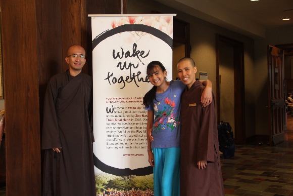Brother Phap Nang and Sister Khai Nghiem with a practitioner at the Rhodes Day of Mindfulness.