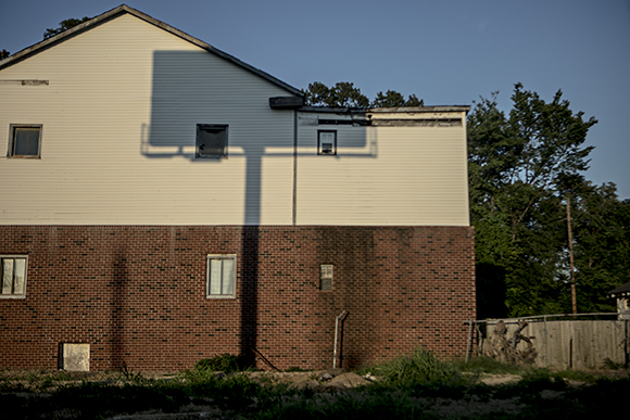 The shadow of a billboard is cast on a home on Vance Avenue.