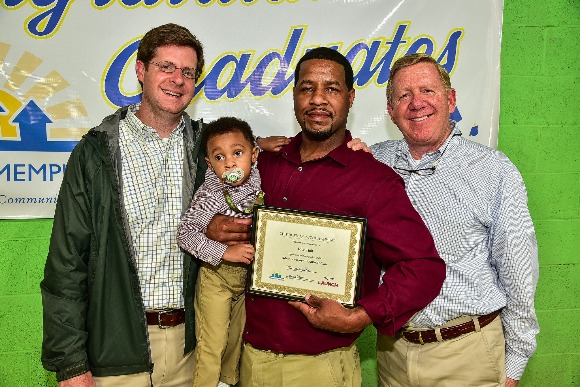 Rico Holt (center) with his son and Advance Memphis staff, including Greg Spillyards (left) who has supported Holt and his business, Premium Cleaning & Maintenance Solutions.