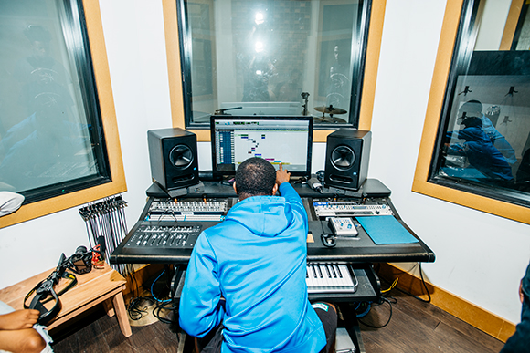 Walter Perry works with Jermey Wilbourne to produce a song in Cloud901's recording studio.