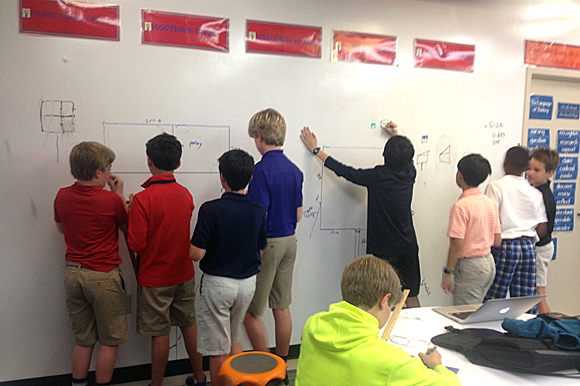 The students took their original blueprints and drew them out to scale on the whiteboard walls at PDS.