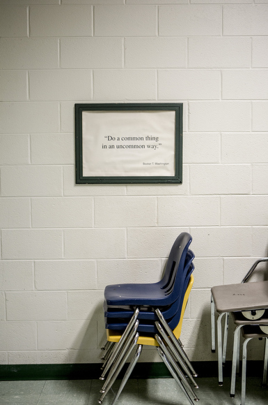 In the halls of the school, a framed quote from its namesake Booker T. Washington reads "Do a common thing in an uncommon way."