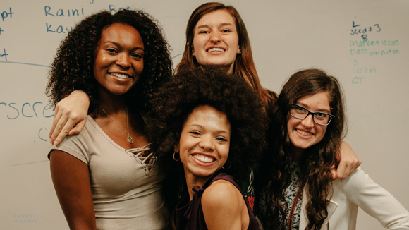 The college-aged counselors of Envision Lead Grow, a traveling summer camp that instructs middle-school girls in launching their own businesses. 
