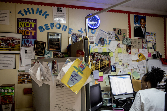 Kimberly Norman, a volunteer at the Vance Avenue Youth Development Center, works at a computer.