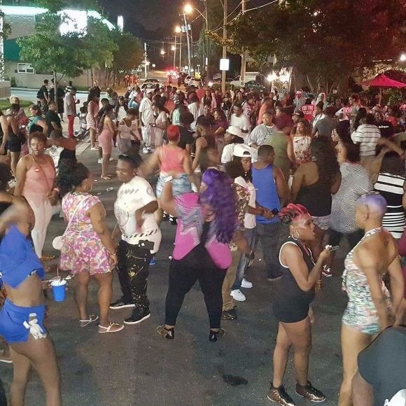 Partiers at the Tri-State Girls Black Pride block party outside of Side Street Grill.