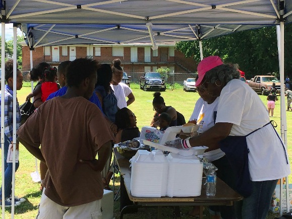 Barbara Taylor serves up boxes with pulled pork, baked beans, and chicken wings to South Memphians.