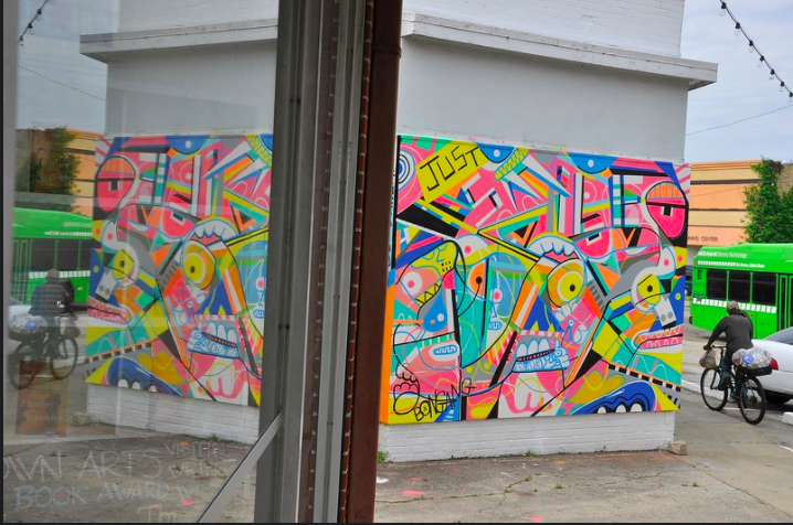 A temporary mural backed by The Moonpie Project brightens a corner of Crosstown.