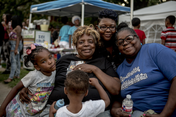 Betty Isom, founder of the Stop the Violence block party, surrounded by friends and family.