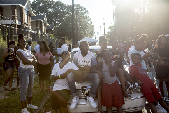 Folks watched acts on stage from a parked car on the Tate Street.