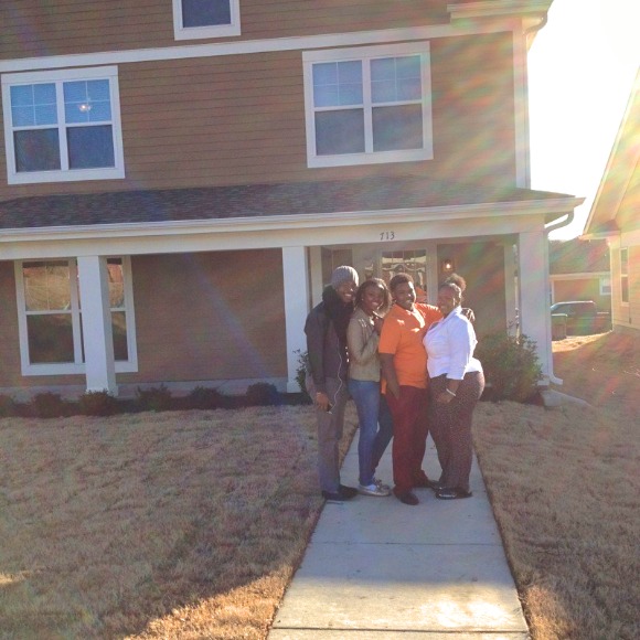 LaTonya Taylor and her family stand in front of the home Taylor purchased in ZIP 38126 with the help of the RISE Foundation's Save Up program. 