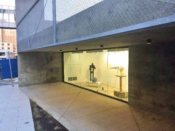 A shadow box gallery illuminates a new pocket park adjacent to Maggie H. Isabel alley.