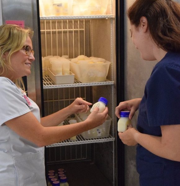 Ashley Smith (L) and Elaina Hogan with the milk depot at Regional One Health.