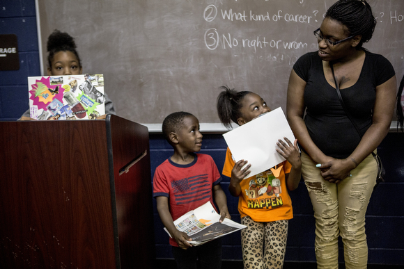 Bouts of shyness hit the group of kids about to present their vision boards as part of a Mother's Day program.