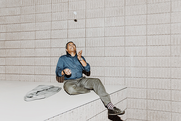 Sridhar Sunkara, president of ThinkProxi, juggling a beacon device.