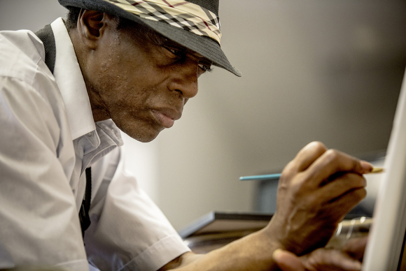 Painter Larry Walker in the Kate Sexton Community Center where he creates art.