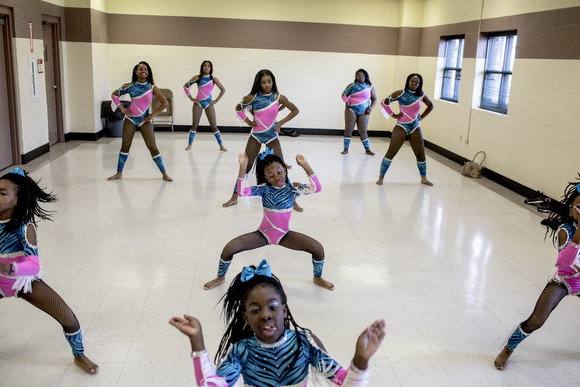The Diva Sensations majorette team runs through dress rehearsal at the Dave Wells Community Center in Smokey City.