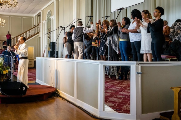Dr. Allen Todd directs the Sunday choir at New Olivet Worship Center.