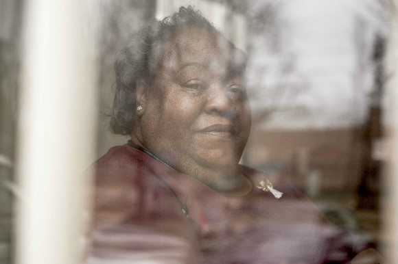 Quincy Morris seen through the window of the Klondike Smokey City CDC.