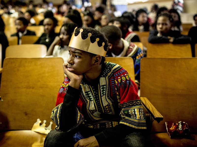Students at Humes Preparatory Academy wait for parents and community members to take their seats.