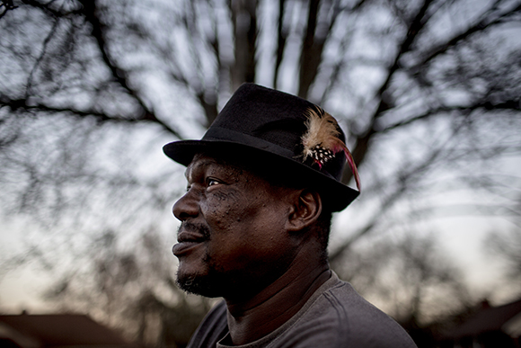 Clint Eastwood, Smokey City resident, stands for a portrait while at a cookout near the old Firestone plant. In the 1970s he was one of the many people who worked in the community's industrial center along the shipping lines that traveled through New Chicago. 