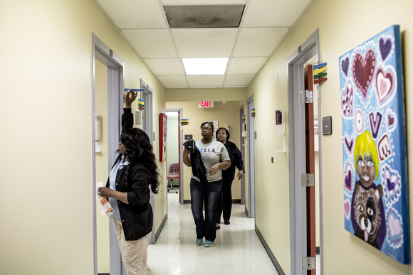Christine Jones, 17, and her mother Irma walk down the hall toward an exam room while being seen at the Guthrie Primary Care Clinic in Smokey City.