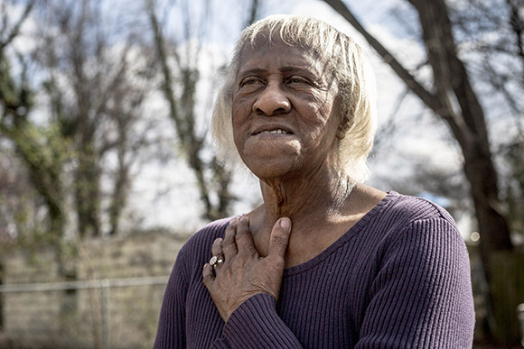 Mary Hill, 82, stands for a portrait at her home in Smokey City. She grew up in Klondike and has lived in Smokey City as an adult.