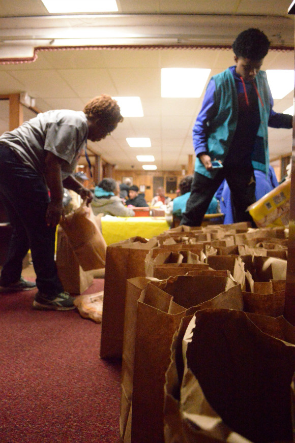 In addition to a homemade meal to Klondike Smokey City residents, the Friendship Feeding Program also sends their neighbors home with bags of canned goods and several pounds of frozen chicken.