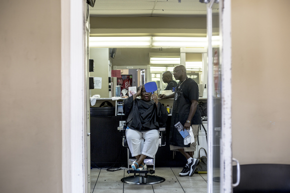 Customers come through The Barber School on Jackson Avenue on the edge of Klondike. 