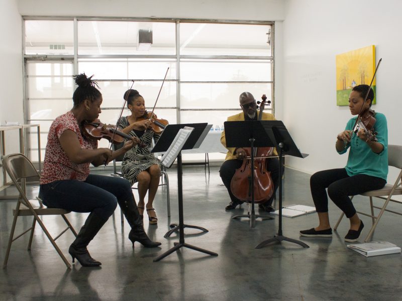 Members of the PRIZM Chamber Orchestra play as a string quartet during a meet and greet at Orange Mound Gallery on November 3. (From left to right: Chala Yancy, violin; Tami Hughes, violin; Derek Menchan, cello; and Dana Kelley, viola.