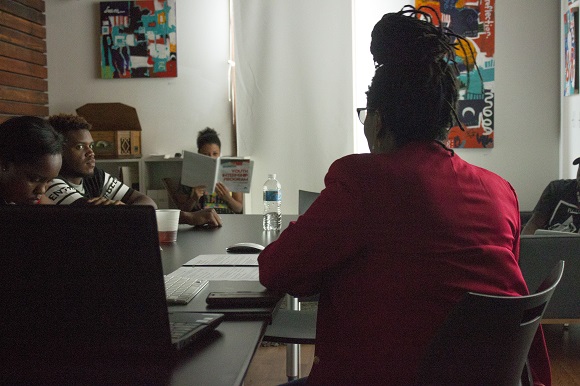 Tonya Dyson goes over social media strategy with high school intern at Memphis Slim House