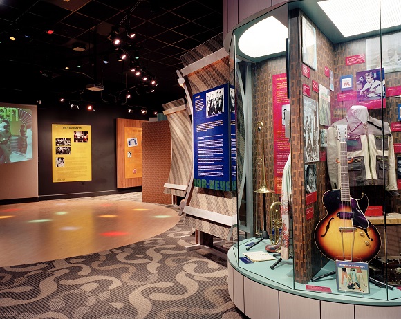 A museum exhibit features a replica of the Soul Train dance floor, circa 1970, with original footage from the program.