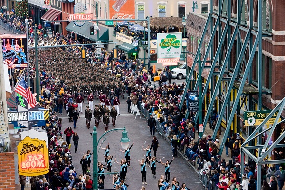 The day before the big game, a parade down Beale Street ends in a pep rally