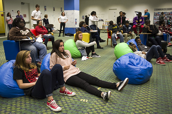 Teenagers watch a televised TED Talk livestream during a kickoff event for the new Teen Learning Lab inside the Benjamin L. Hooks Central Library.
