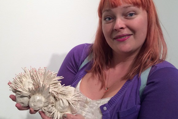 Nikkila Carroll holds part of her work at the Hyde Gallery