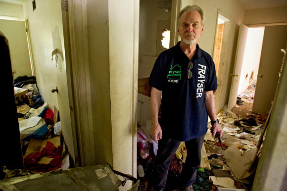 Lockwood stands inside the dilapidated house at 3131 Mountain Terrace in Frayser