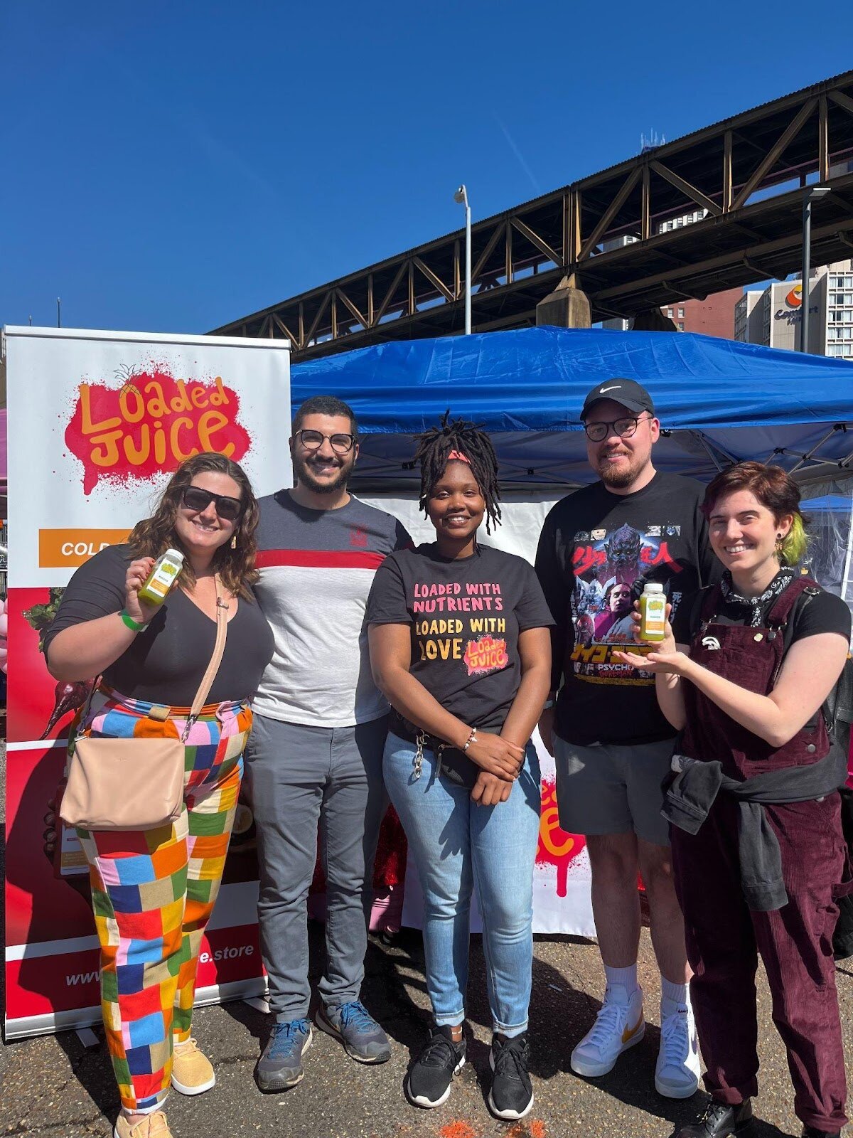 Carter (center) posing with customers at the Shop Black Festival in downtown Memphis.