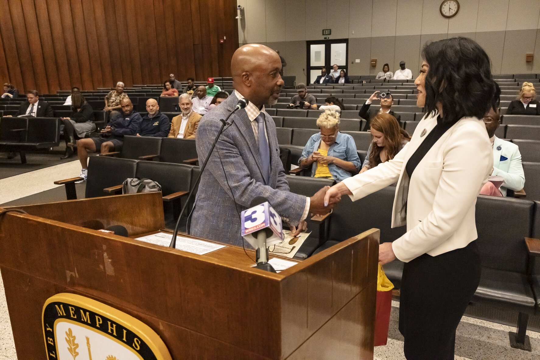 Councilman Martavius Jones, who sponsored the resolution acknowledging AAPI Heritage Month, congratulates Dr. SunAh Laybourn on Tuesday, May 2, at City Hall. (Photo by Ziggy Mack / Courtesy of Dr. SunAh Laybourn)