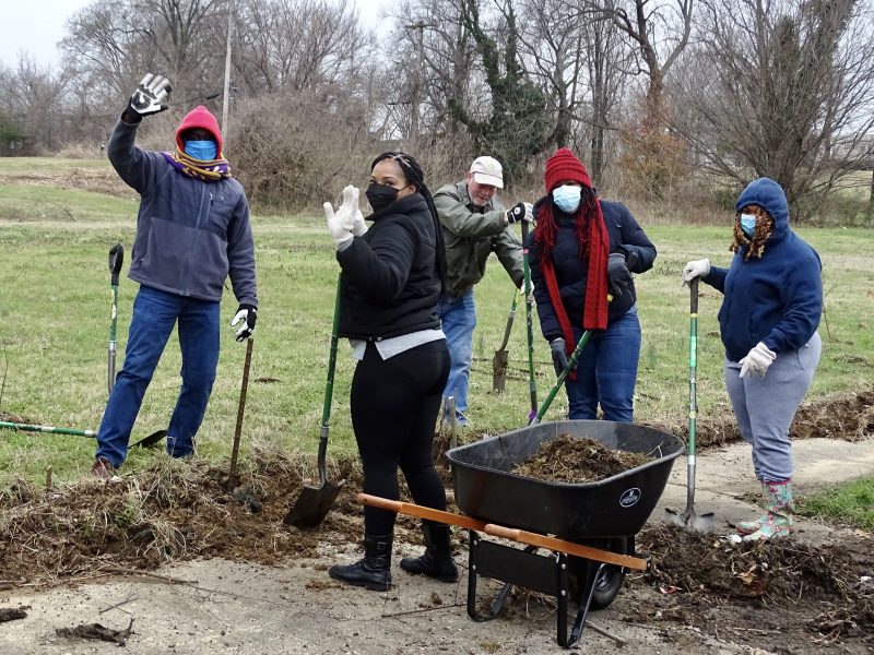 Volunteers with The Works CDC work together to clear a sidewalk along Jefferson Ave. (submitted)