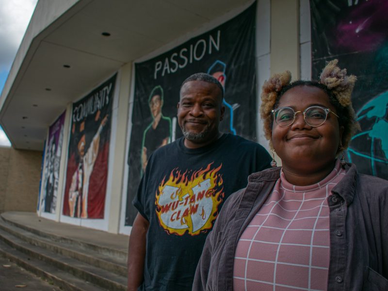 Father-child artist duo Theo James (L) and Nisa Williams (R) stand in front of the mural they created for the Mid-South Coliseum Coalition, Sept. 13, 2021 (Sarah Rushakoff)