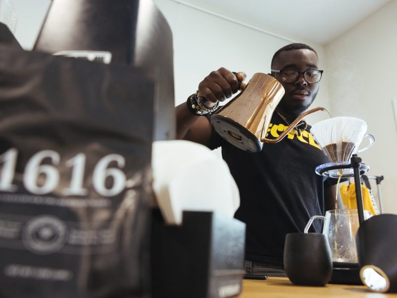 Monterrion Webber makes a cup of coffee for a patron of Cxffeeblack at the Anti-Gentrification Coffee Club #1, located at 751 National Street in The Heights. (Ziggy Mack)