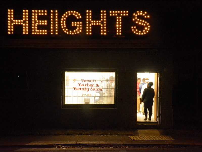 The vacant barber shop at 769 National Street was topped with a sign made from repurposed Christmas lights and the boards that once shuttered the windows. (Markus Mueller)